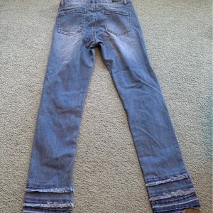 Jeans with distressing on bottoms